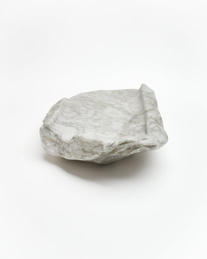 Back view: gray-green alabaster tray with gray streaks, smooth and raw edges.
