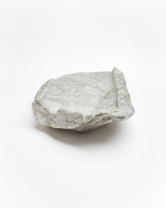 Back view: gray-green alabaster tray with gray streaks, smooth and raw edges.