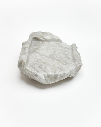 Front view: gray-green alabaster tray with gray streaks, beige flecks, smooth and raw edges.