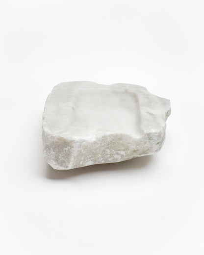 Front view: organic-rectangle off-white alabaster tray with raw edges and subtle marks.