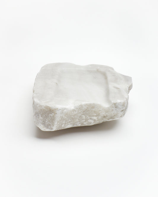 Front view: organic-rectangle off-white alabaster tray with raw edges and subtle marks.