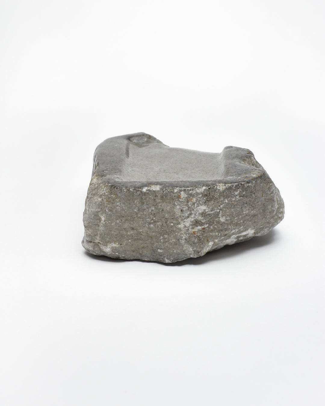 Back view: organic-rectangle-shaped gray stone tray with raw edges.