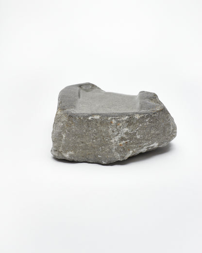 Back view: organic-rectangle-shaped gray stone tray with raw edges.