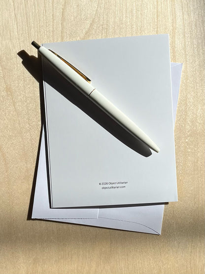 Back of greeting card, text “© 2026 Object Utilitarian objectutilitarian.com” with envelope and pen.